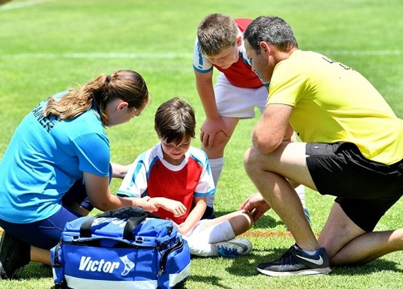 First aid responder assisting at a sporting event